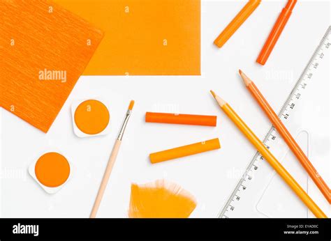 Orange Color School Supplies On White Paper Background Stock Photo Alamy