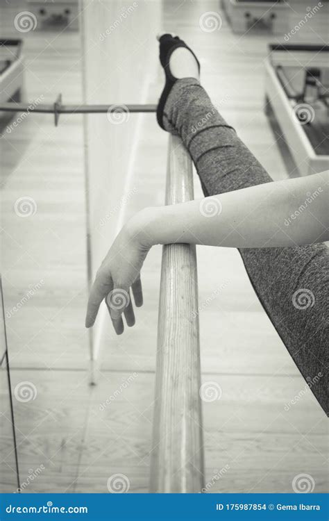 Female Dancer Doing Stretching On The Ballet Barre Stock Photo Image