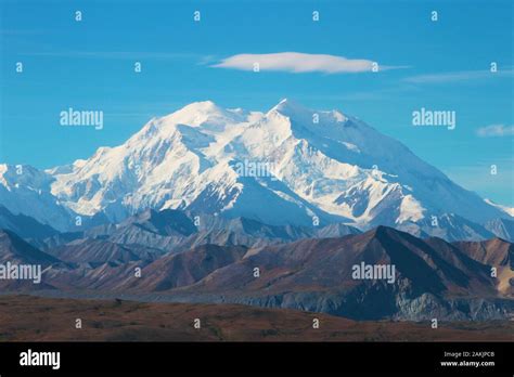 Denali Mountain In Alaska With Blue Sky And Cloud Floating Above The