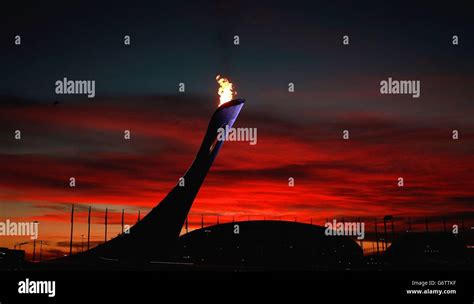 The Sunsets Over The Bolshoy Ice Dome And The Olympic Flame In The
