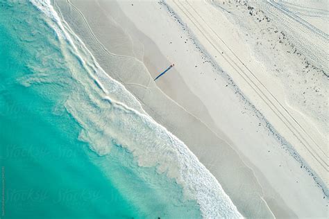 Aerial Image Of Summertime Beach Scene Of White Sandy Beach And Clear