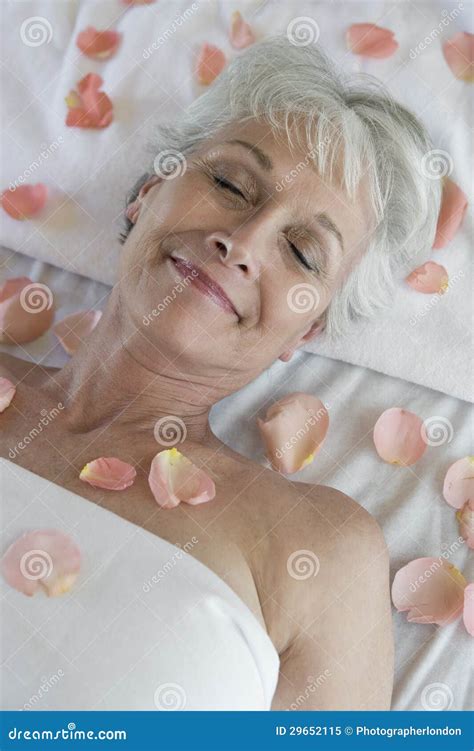 Senior Woman Lying On Massage Table At Spa Stock Image Image Of