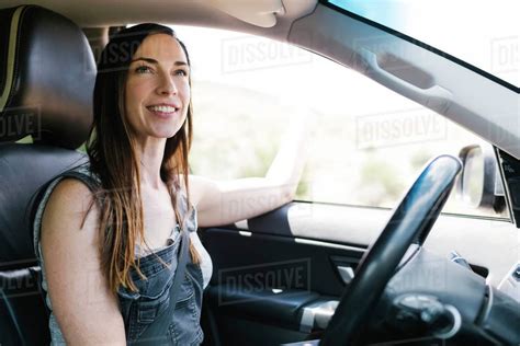 Smiling Woman Driving Car Stock Photo Dissolve