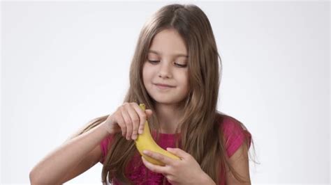 490 girl eating a banana stock videos and royalty free footage istock