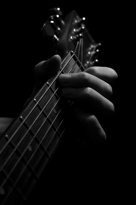 Grayscale Photography Of Person Playing Guitar Electric Guitar