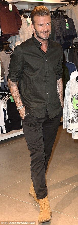 David Beckham Looks Dapper In A Black Dress Shirt With The Sleeves
