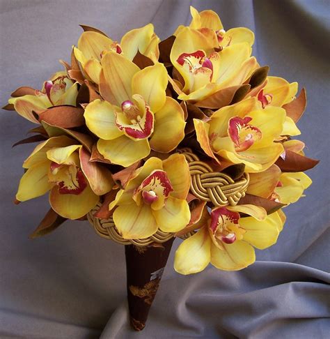 These Orchids Are The Perfect Hue For Fall Yellow Wedding Flowers Yellow Flower Arrangements