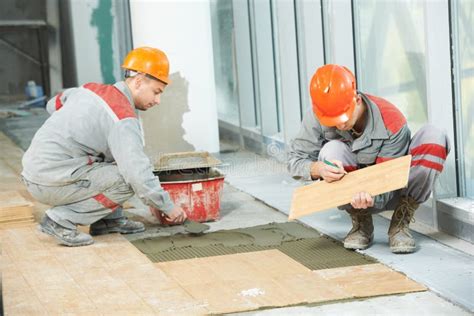 Two Tilers At Industrial Floor Tiling Renovation Stock Image Image Of