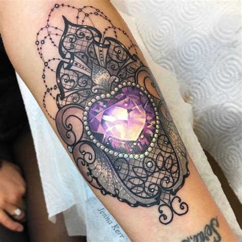 These witch tattoo designs inspired by witches, magic, and the occult are just what you need to embrace your inner power. Ornamental Pink Jewel Tattoo