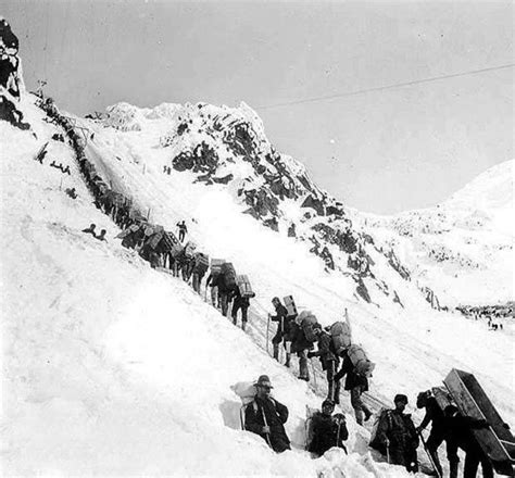 Amazing Photographs Of Prospectors Carrying Supplies Ascending The