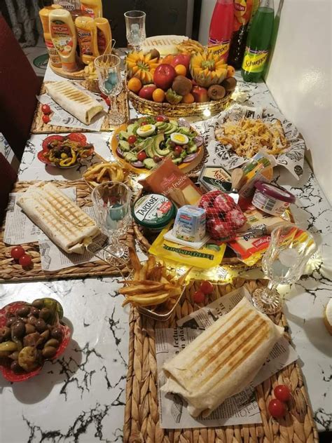 A Table Topped With Lots Of Food And Drinks