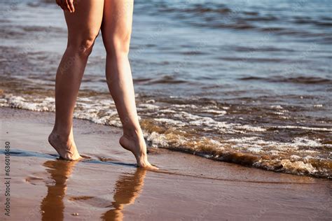 Crop Photo Of Naked Legs Woman Nudist Walking On Sea Beach Outdoors Close Up Foots Of Nude