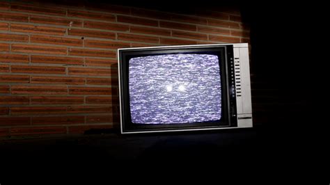 Old Television in front of brick wall Stock Video Footage - Storyblocks