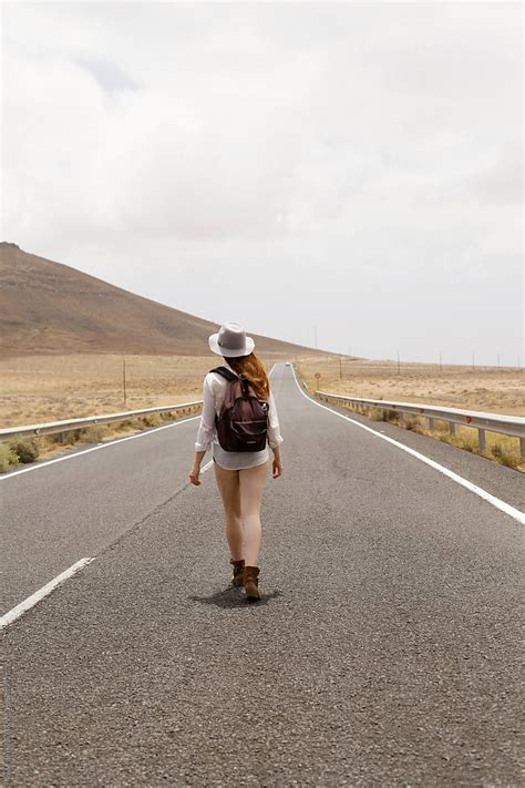 Woman Walking On Road Del Colaborador De Stocksy Rene De Haan Stocksy