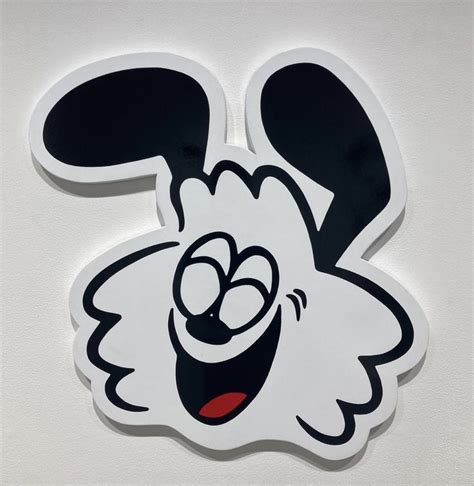 A White And Black Sticker With A Cartoon Character