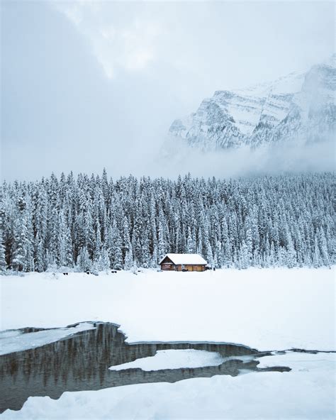 Small Cozy Winter Cabin In Front Of A Frozen Lake Lake Louise Canada