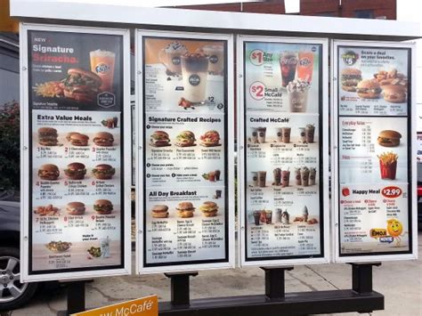 The golden arches logo, mcdonald's and happy meal are registered trademarks of mcdonald's corporation and its affiliates. menu board at drive-thru - Picture of McDonald's ...