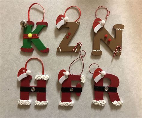 Wooden Letter Ornaments Decorated As An Elf Gingerbread And Santa