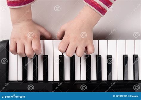 Little Kids Hands Playing Piano Top View Education Concept Stock Image