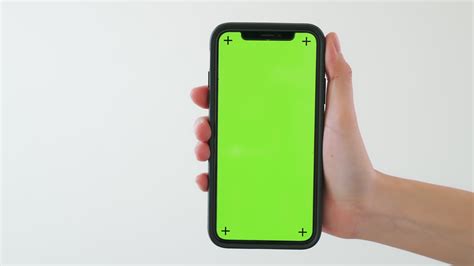 Hand Holding A Smartphone With Green Screen Stock Video At Vecteezy