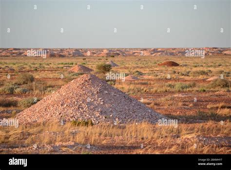 Mounds Of Sand And Rock Are Opal Mine Tailings In The Outback Desert Of