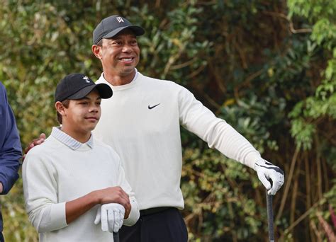 WATCH Tiger Woods Cant Help But Laugh At Charlie Imitating His Fist