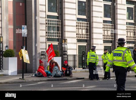 Greenpeace Protestors Chained To Oil Barrels Outside Bps London