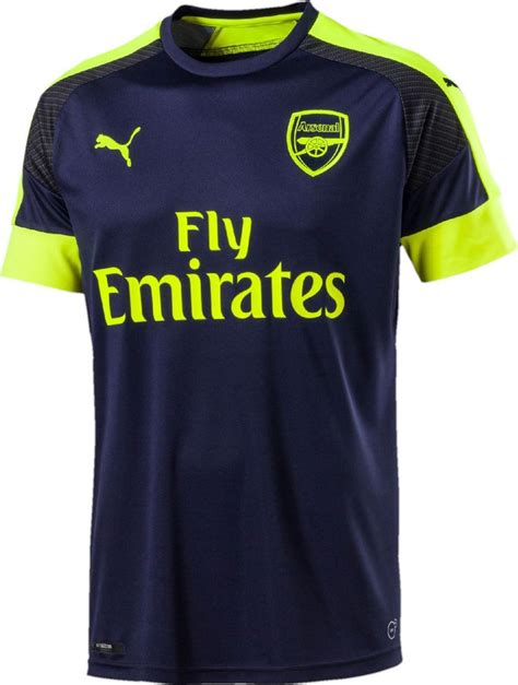 In de praktijk kom dit neer op een. The Arsenal 16-17 third kit is dark navy with fluorescent ...