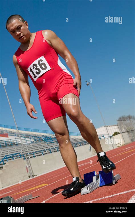 Male Sprinter Preparing To Start Stock Photo Alamy