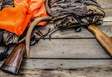 Deer Hunting Gear Background With Rifles Rattling Antlers Deer Call