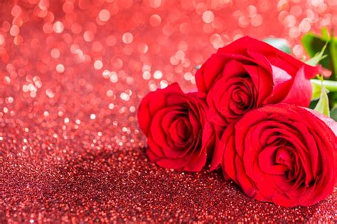 Red Roses On Glitters Three Beautiful Red Roses On Glitter Background