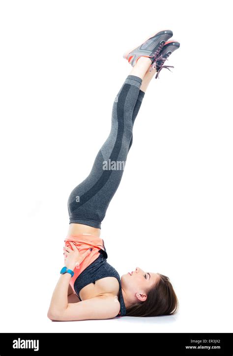 Young Woman Lying On The Floor And Doing Stretching Exercises Isolated