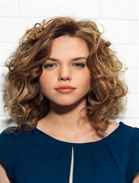 A simple haircut for curly hair that features a longer fringe in the front and a mid bald fade on the sides. 20 Photos Short Hairstyles for Round Faces Curly Hair