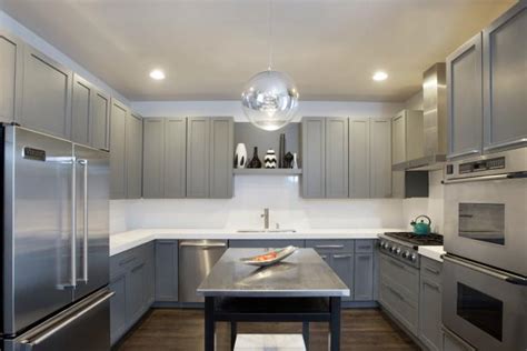 Design and buy your own stainless kitchen with our online design tool! Modern Kitchen With Gray Cabinets and Globe Pendant | HGTV