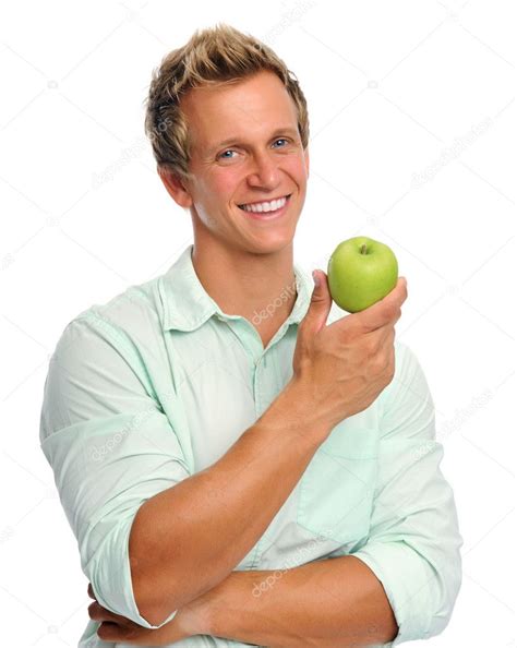 Handsome Young Man Holding An Apple Stock Photo By ©daxiaoproductions