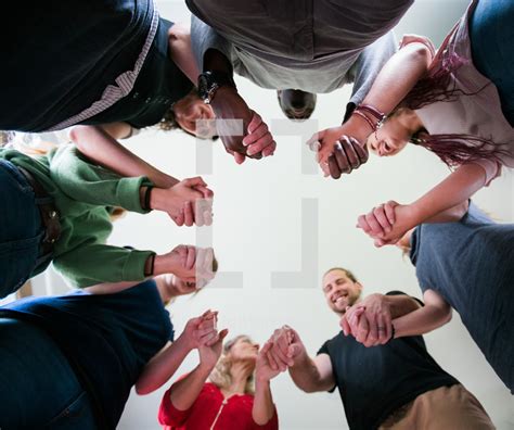 Group Holding Hands In A Pray Circle — Photo — Lightstock