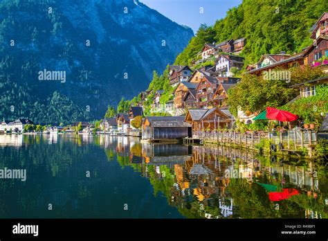 Traditional Old Wooden Houses In Famous Hallstatt Mountain Village At
