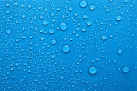 Water Drops Light Blue Background Top View Stock Photo By ©newafrica