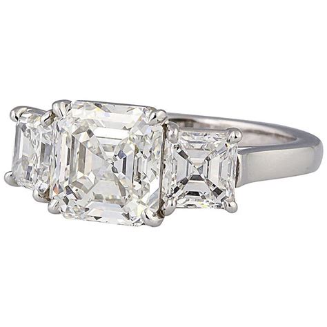 Center stone is 0.97 cts, g color, vs1 clarity and set in platinum. Tiffany and Co. Three-Stone Diamond Platinum Engagement Ring at 1stdibs