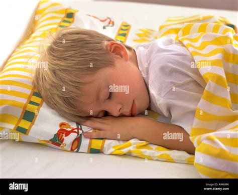 Little Boy Sleeping In Bed Stock Photo Alamy