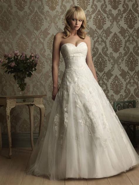 Delicate chantilly lace insets sewn at the plunging neckline and open back add romantic allure to this ethereal chiffon gown. ball gown sweetheart neckline wedding dress with lace ...