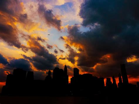 New York City Skyline At Sunset Under Clouds Photograph By Vivienne