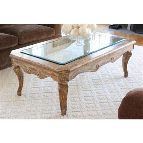 Glass coffee tables come in a wide array of shapes, sizes, designs, and patterns. Inset Beveled Glass Top Distressed Coffee Table | Chairish