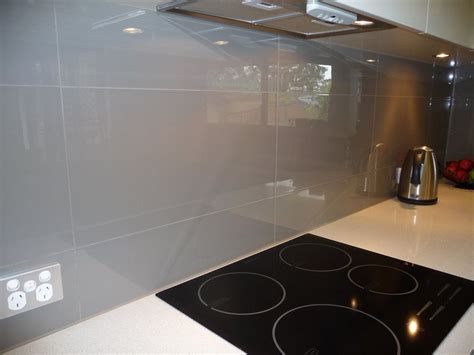The 3d tiles used in this kitchen gives you a feeling of space and depth and makes your powder blue small kitchen look large and spacious. Large grey gloss tile for backsplash. I really like it ...