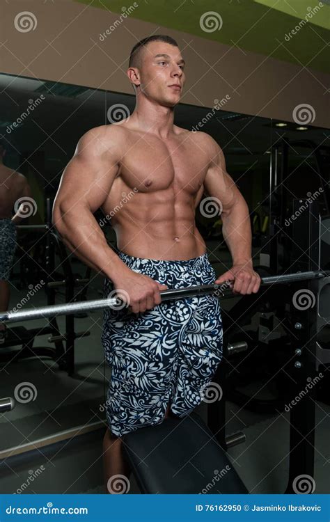 Muscular Man Flexing Muscles In Gym Stock Photo Image Of Body