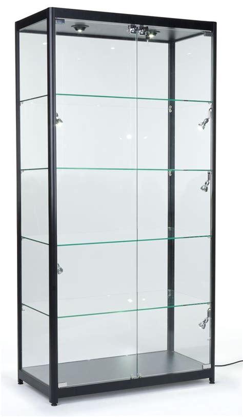 This curio cabinet displays your favourite collectibles and trinkets beautifully on adjustable glass shelves; Displays2go Tempered Glass Curio Cabinet With 8 Halogen ...