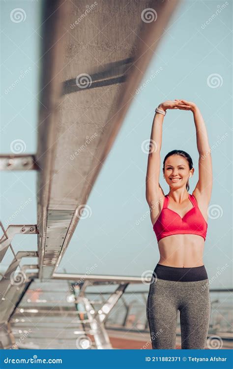 Fit Brunette Stretching On An Exercise Ball Stock Photo Cartoondealer Com