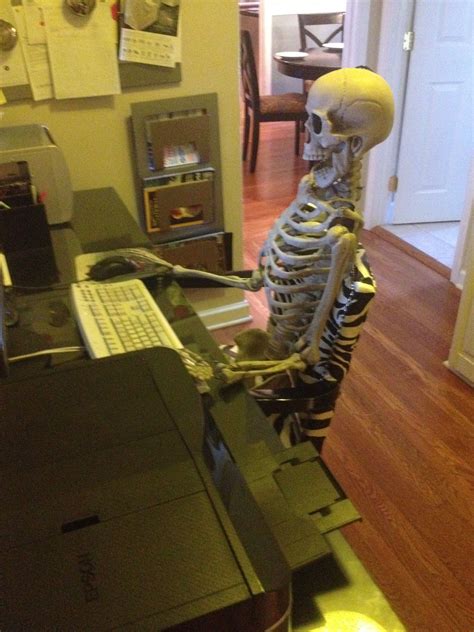Skeleton Waiting At Desk