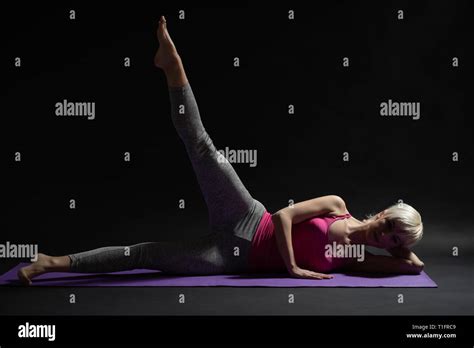 Woman Exercising Pilates Side Lying Leg Raise Exercise Stock Photo Alamy
