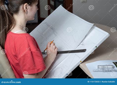 The Architect Prepares Drawings On A White Drawing With A Ruler And A